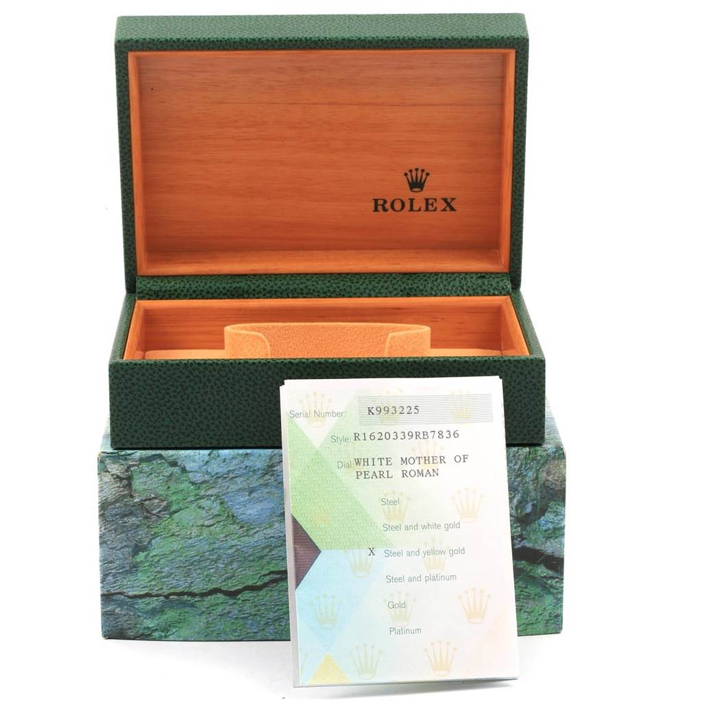 The image shows an open Rolex box for a Datejust model, displaying its interior and a specifications card.