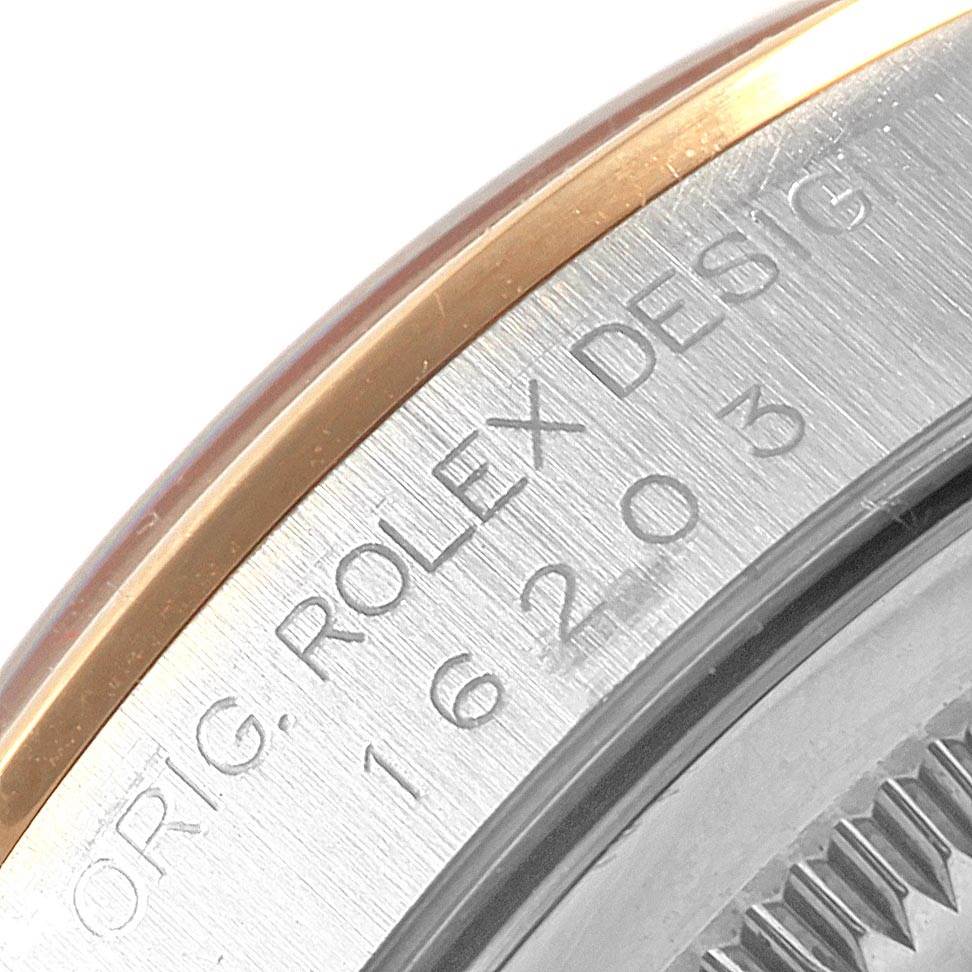 The image shows a close-up of the Rolex Datejust 16203 Men's Steel and Gold (two tone) Mother of Pearl Dial 16203 Men's Steel and Gold (two tone) Mother of Pearl Dial watch bezel and part of the engraved model number.