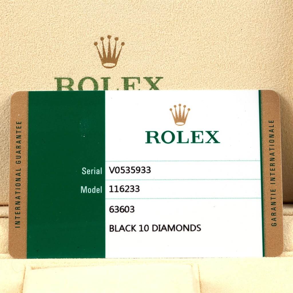 The image shows a Rolex Datejust 116233 Men
s Stainless Steel Black Dial 116233 Men
s Stainless Steel Black Dial guarantee card with its serial number, model number, and details about the watch
s features.
