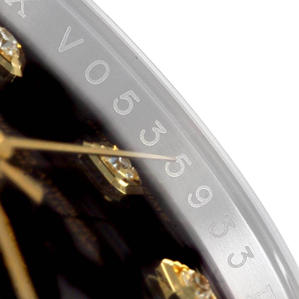 The image shows a close-up of the dial and edge of a Rolex Datejust 116233 Men
s Stainless Steel Black Dial 116233 Men
s Stainless Steel Black Dial watch, highlighting the serial number engraving and diamond hour markers.