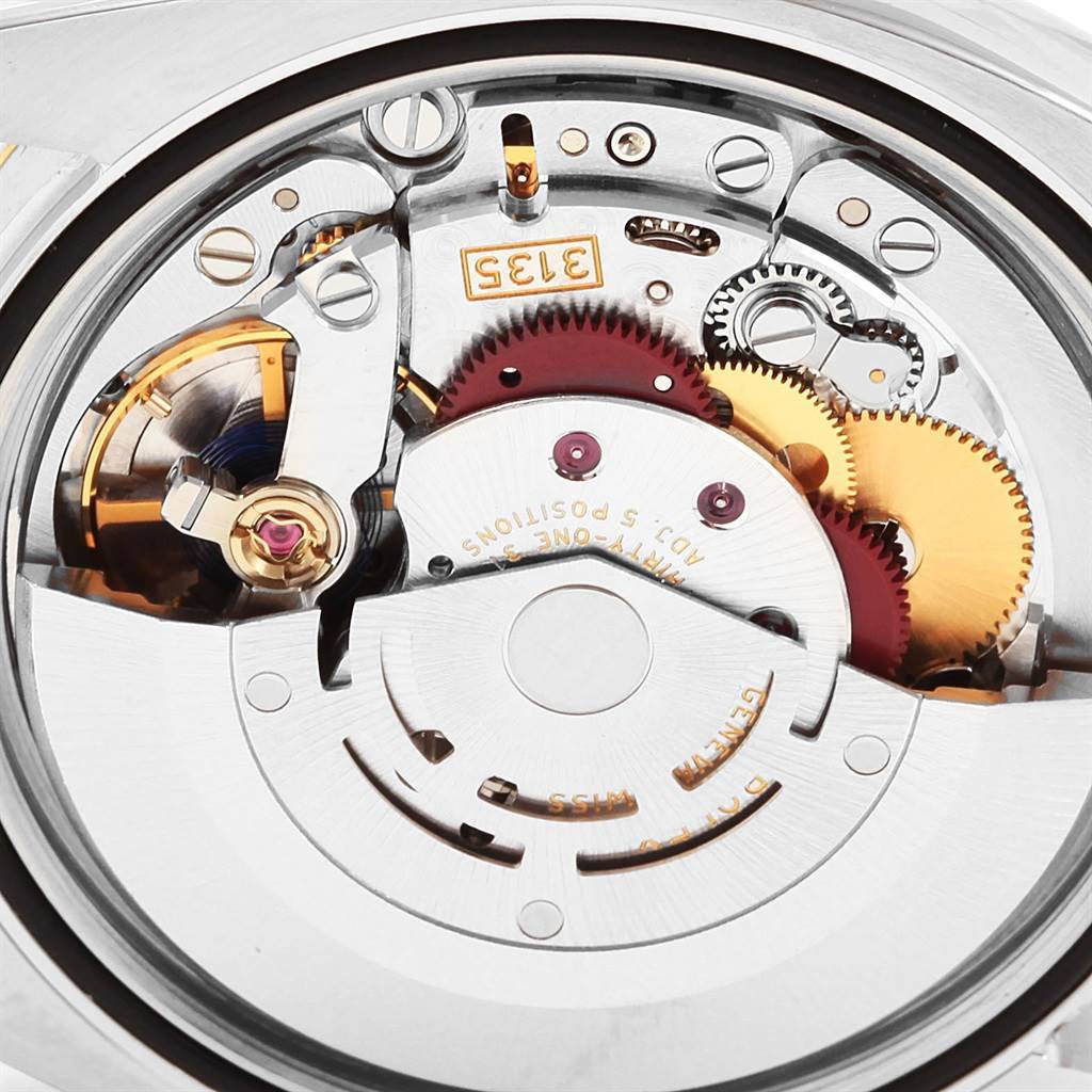 This close-up image shows the intricate internal mechanics of a Rolex Datejust 116233 Men's Stainless Steel Black Dial 116233 Men's Stainless Steel Black Dial watch movement.