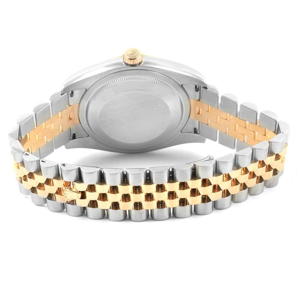 The image shows the backside of the Datejust model by Rolex, highlighting the case back and two-tone bracelet.