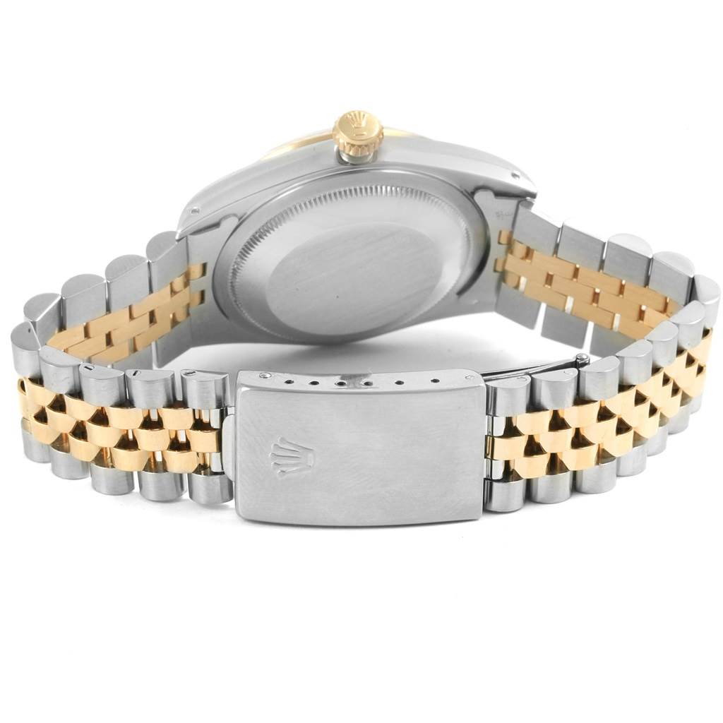 The image shows the back case and two-tone bracelet of a Rolex Datejust 16233 Men
s Steel and Gold (two tone) Black Dial 16233 Men
s Steel and Gold (two tone) Black Dial watch.