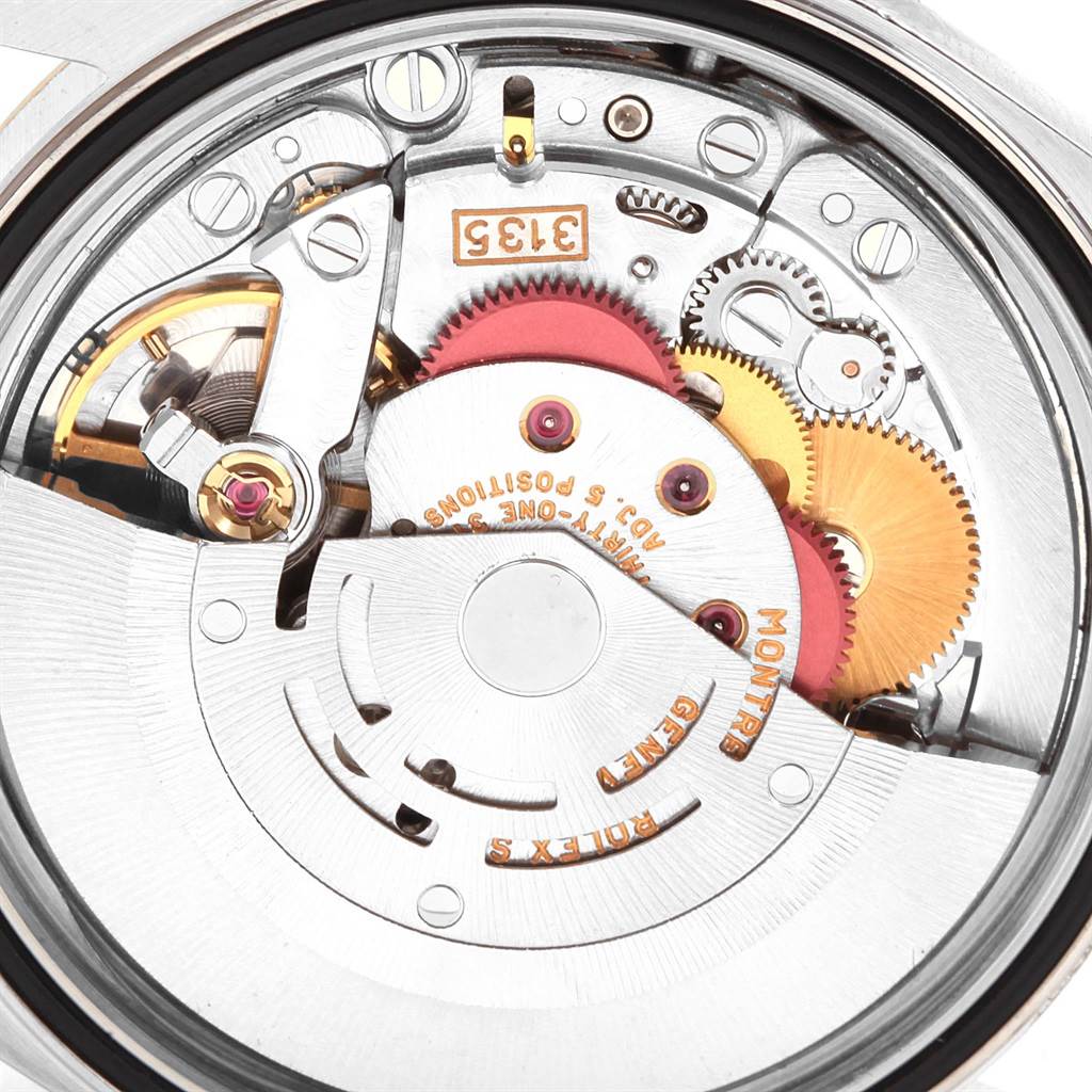 This image shows the internal mechanism of the Rolex Datejust 16233 Men
s Steel and Gold (two tone) Black Dial 16233 Men
s Steel and Gold (two tone) Black Dial watch, featuring visible gears and components.