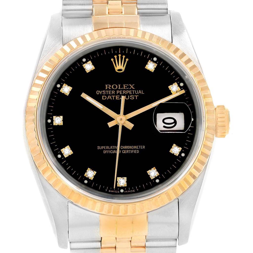 This image shows a close-up of a Rolex Datejust 16233 Men
s Steel and Gold (two tone) Black Dial 16233 Men
s Steel and Gold (two tone) Black Dial watch featuring a black dial, gold details, and a two-tone bracelet.
