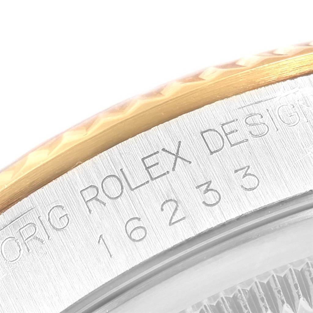 The image shows a close-up of the case and bezel of a Rolex Datejust 16233 Men's Steel and Gold (two tone) White Dial 16233 Men's Steel and Gold (two tone) White Dial watch, showcasing the model number and design engravings.