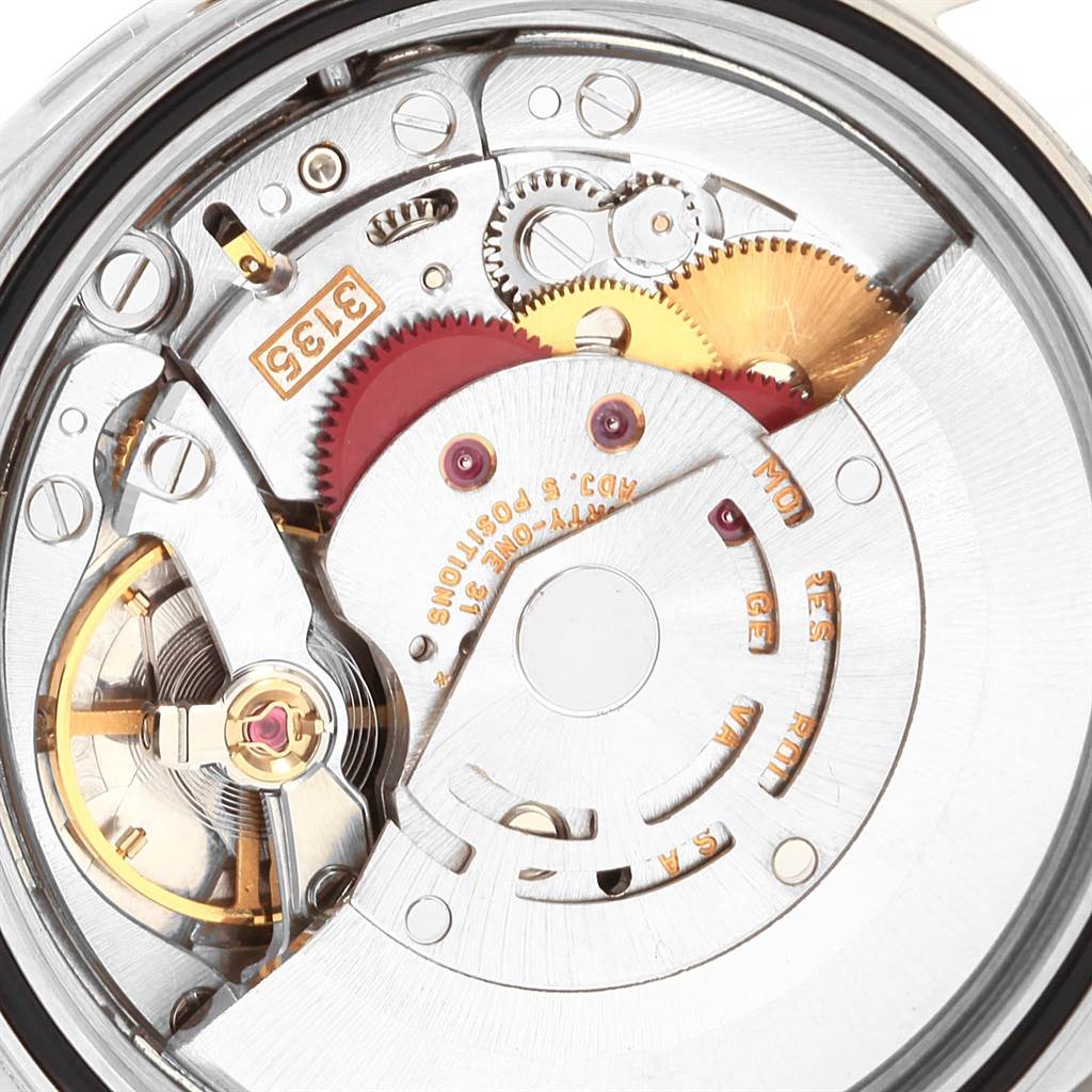 This image shows the intricate internal mechanism of a Rolex Datejust 16233 Men's Steel and Gold (two tone) White Dial 16233 Men's Steel and Gold (two tone) White Dial watch from a close-up, rear-side angle.