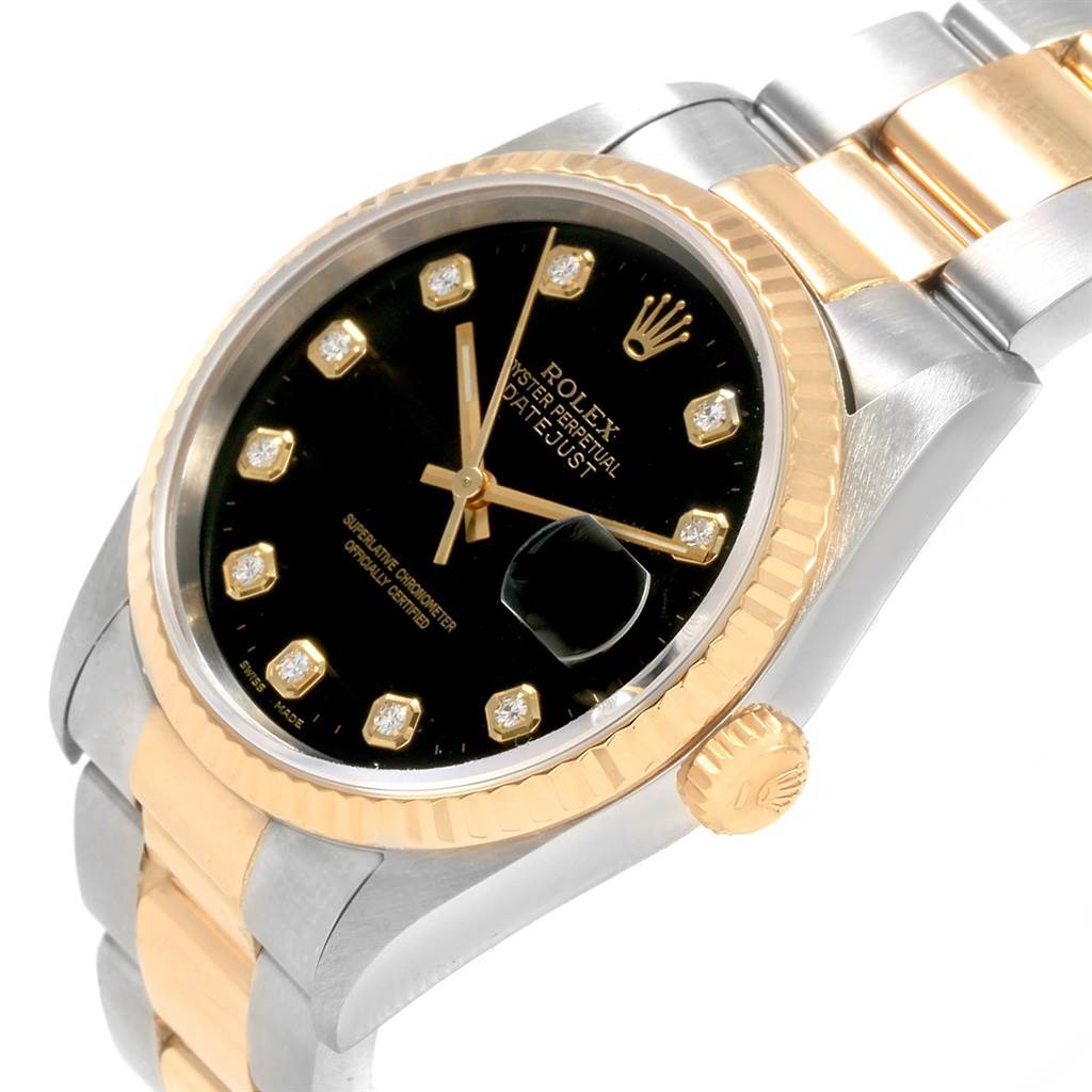 This image shows a Rolex Datejust 16233 Men
s Steel and Gold (two tone) Black Dial 16233 Men
s Steel and Gold (two tone) Black Dial watch at an angled view, highlighting its bezel, dial, crown, and bracelet.