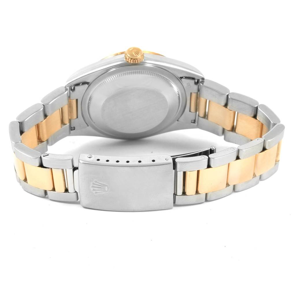 This image shows the back case, crown, and bracelet of a Rolex Datejust 16233 Men
s Steel and Gold (two tone) Black Dial 16233 Men
s Steel and Gold (two tone) Black Dial watch.