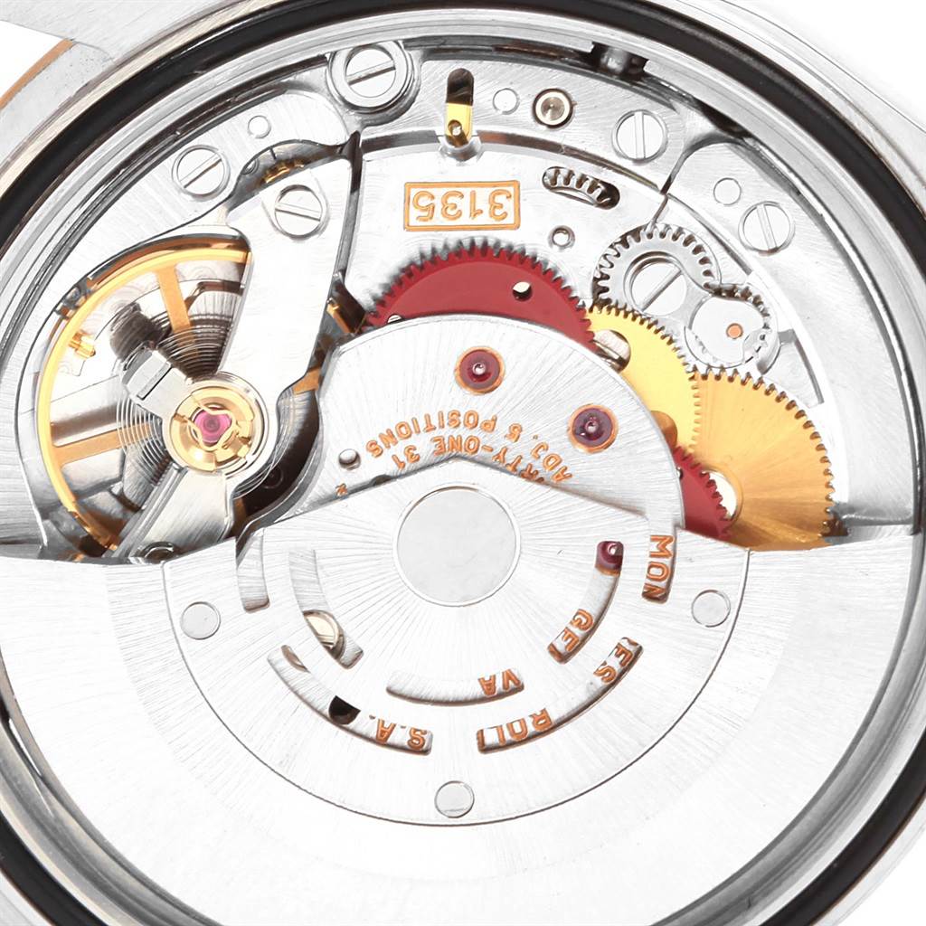 This image shows a close-up view of the inner movement mechanism of a Rolex Datejust 16233 Men
s Steel and Gold (two tone) Black Dial 16233 Men
s Steel and Gold (two tone) Black Dial watch.