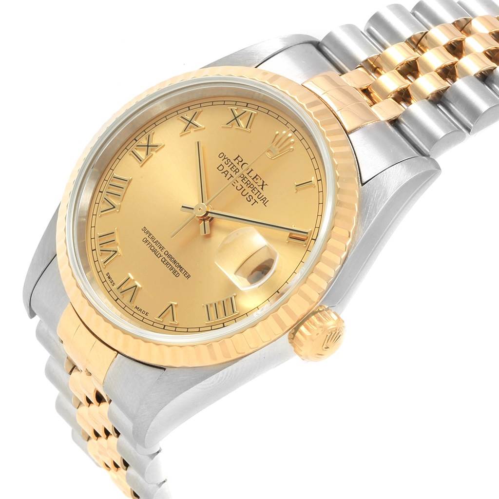 The image shows a Rolex Datejust 16233 Men's Steel and Gold (two tone) Champagne Dial 16233 Men's Steel and Gold (two tone) Champagne Dial watch at an oblique angle, highlighting the dial, fluted bezel, crown, and part of the bracelet.