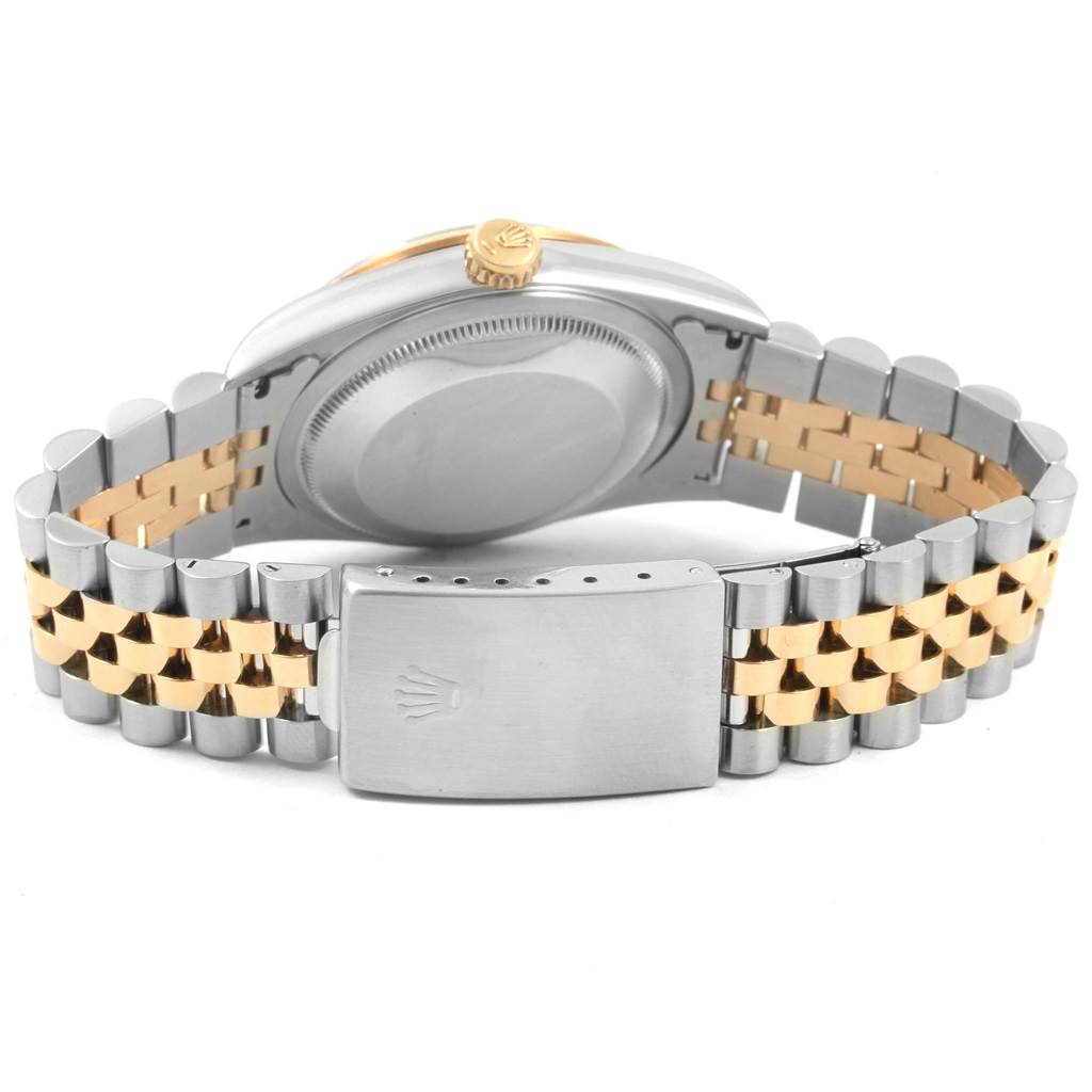 The image shows the back view of a Rolex Datejust 16233 Men's Steel and Gold (two tone) Champagne Dial 16233 Men's Steel and Gold (two tone) Champagne Dial watch, highlighting the case back, crown, and two-tone bracelet with clasp.