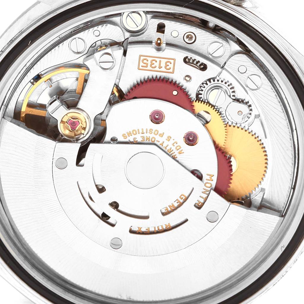 This image shows the internal mechanism of a Rolex Datejust 16220 Men's Stainless Steel Silver Dial 16220 Men's Stainless Steel Silver Dial watch, displaying gears and the rotor.
