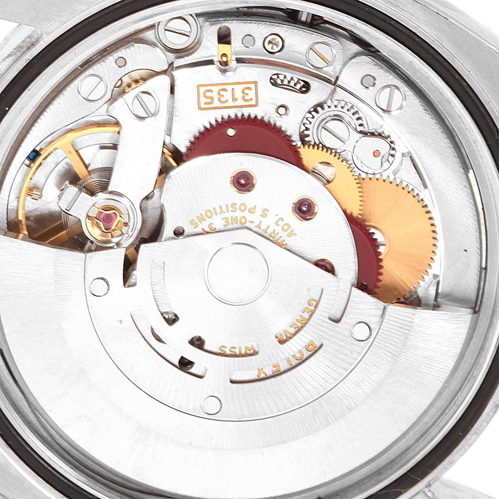 This image shows the intricate movement mechanism of a Rolex Datejust 116233 Men's Steel and Gold (two tone) White Dial 116233 Men's Steel and Gold (two tone) White Dial watch at a close-up angle.