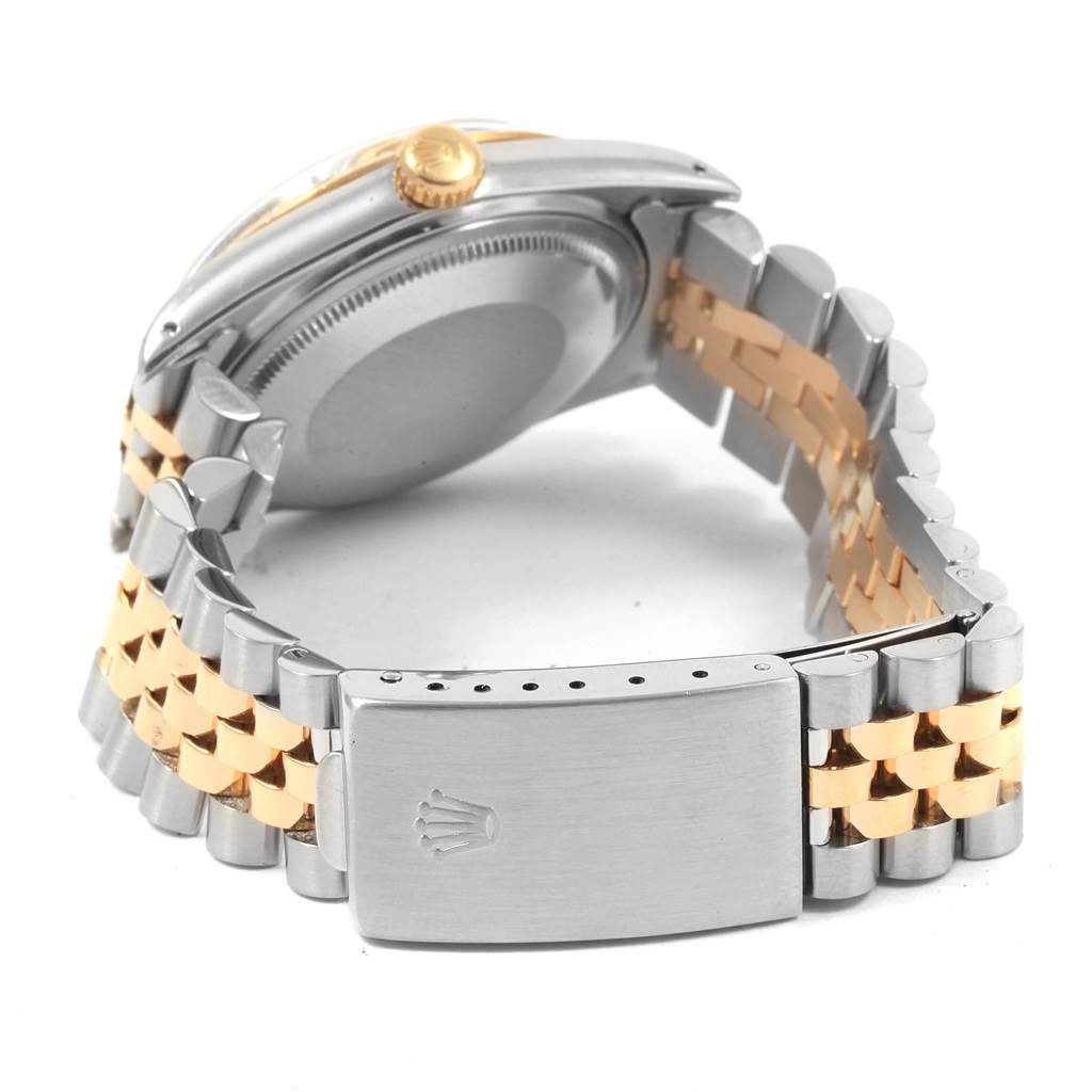 The image shows the back view of a Rolex Datejust 16013 Men's Stainless Steel Champagne Dial 16013 Men's Stainless Steel Champagne Dial watch, including the clasp, bracelet, and crown.