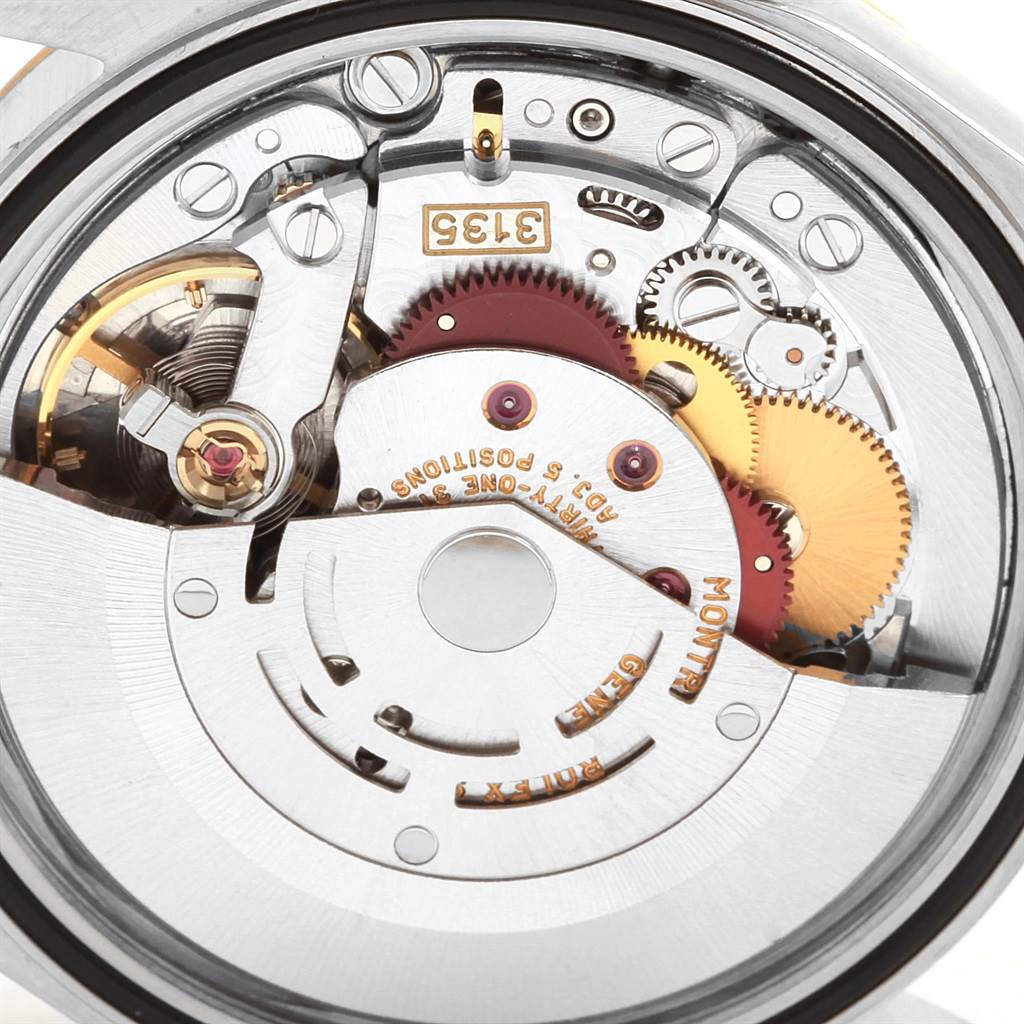 The image shows the internal movement of a Rolex Datejust 16233 Men
s Steel and Gold (two tone) Champagne Dial 16233 Men
s Steel and Gold (two tone) Champagne Dial watch viewed from the back.