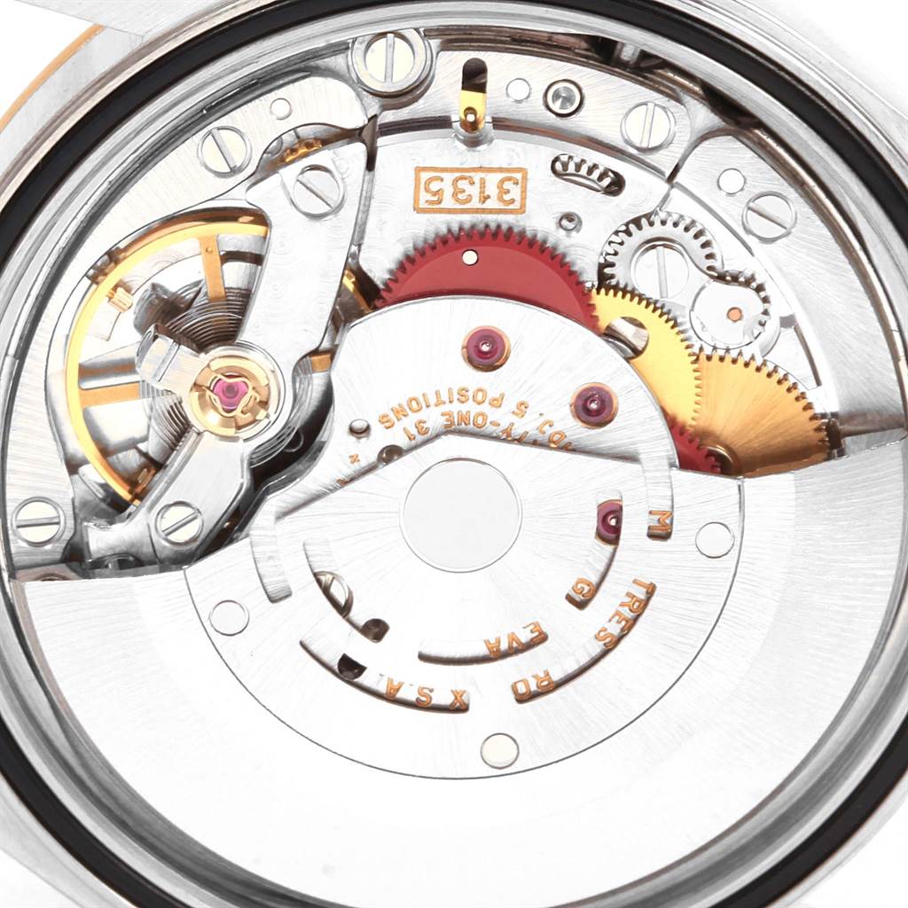 This image shows the movement mechanism of a Rolex Datejust 16233 Men's Steel and Gold (two tone) Black Dial 16233 Men's Steel and Gold (two tone) Black Dial watch from a close-up angle.
