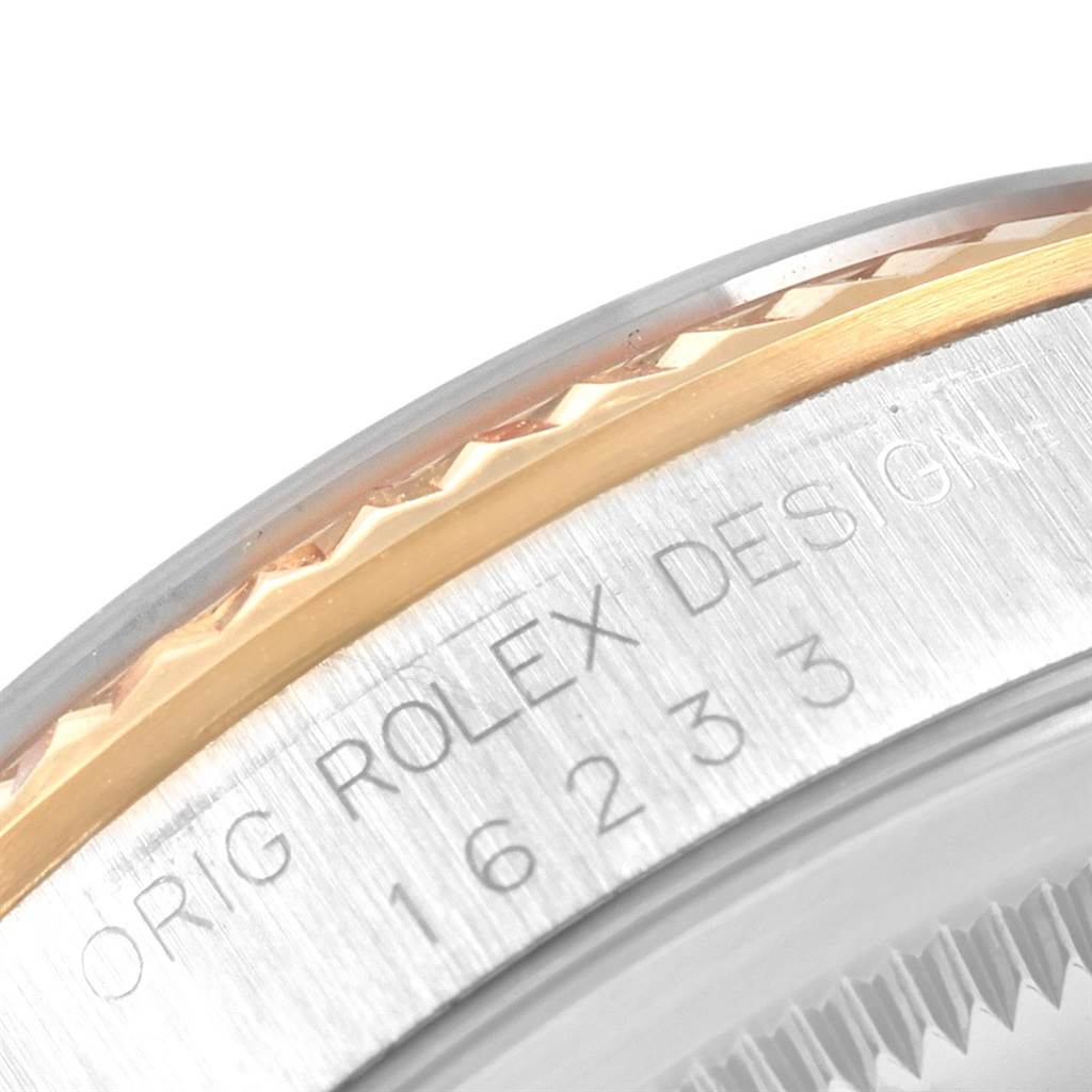 This close-up angle shows the engraved side and edge of the bezel of a Rolex Datejust 16233 Men's Steel and Gold (two tone) Black Dial 16233 Men's Steel and Gold (two tone) Black Dial watch.