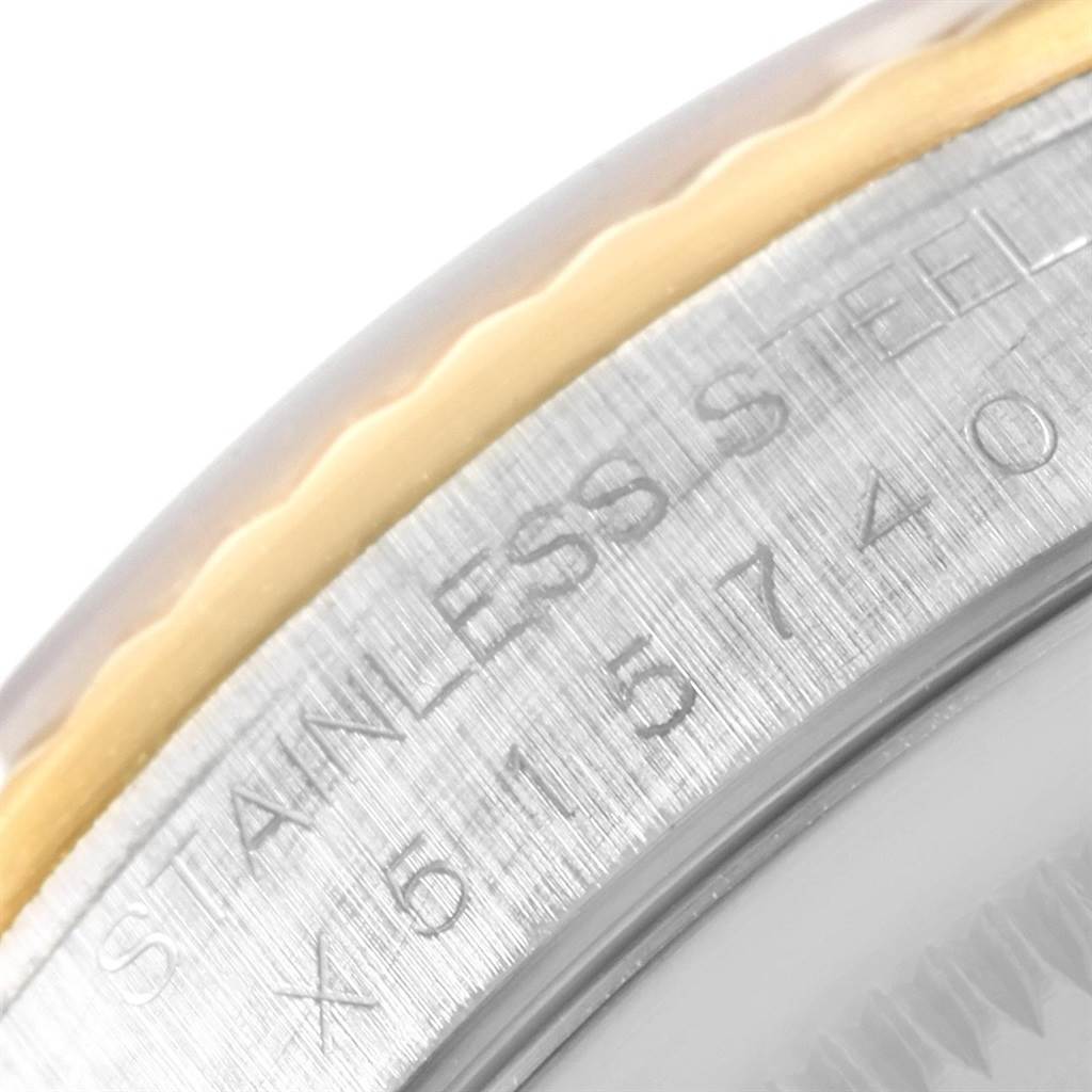 This image shows a close-up of the inscription on the stainless steel case of a Rolex Datejust 16233 Men
s Steel and Gold (two tone) Beige Dial 16233 Men
s Steel and Gold (two tone) Beige Dial watch.