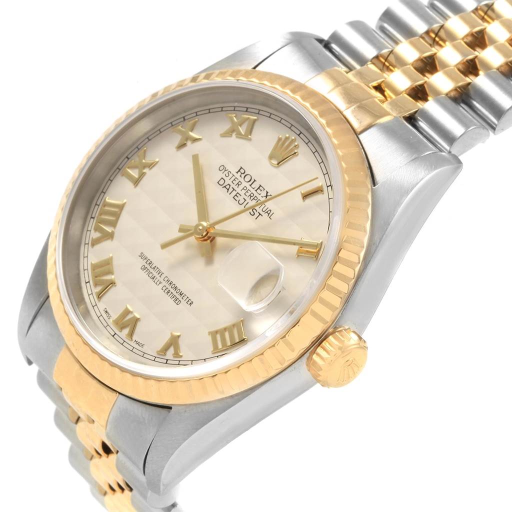 This is an angled close-up of a Rolex Datejust 16233 Men
s Steel and Gold (two tone) Beige Dial 16233 Men
s Steel and Gold (two tone) Beige Dial watch, showing the face, bezel, crown, and part of the bracelet.
