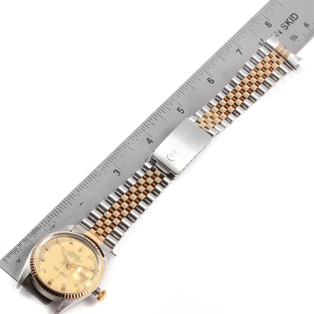 The image shows a Rolex Datejust 16013 Men's Stainless Steel Champagne Dial 16013 Men's Stainless Steel Champagne Dial watch laid flat, with its dial, bezel, bracelet, and clasp visible, alongside a ruler.