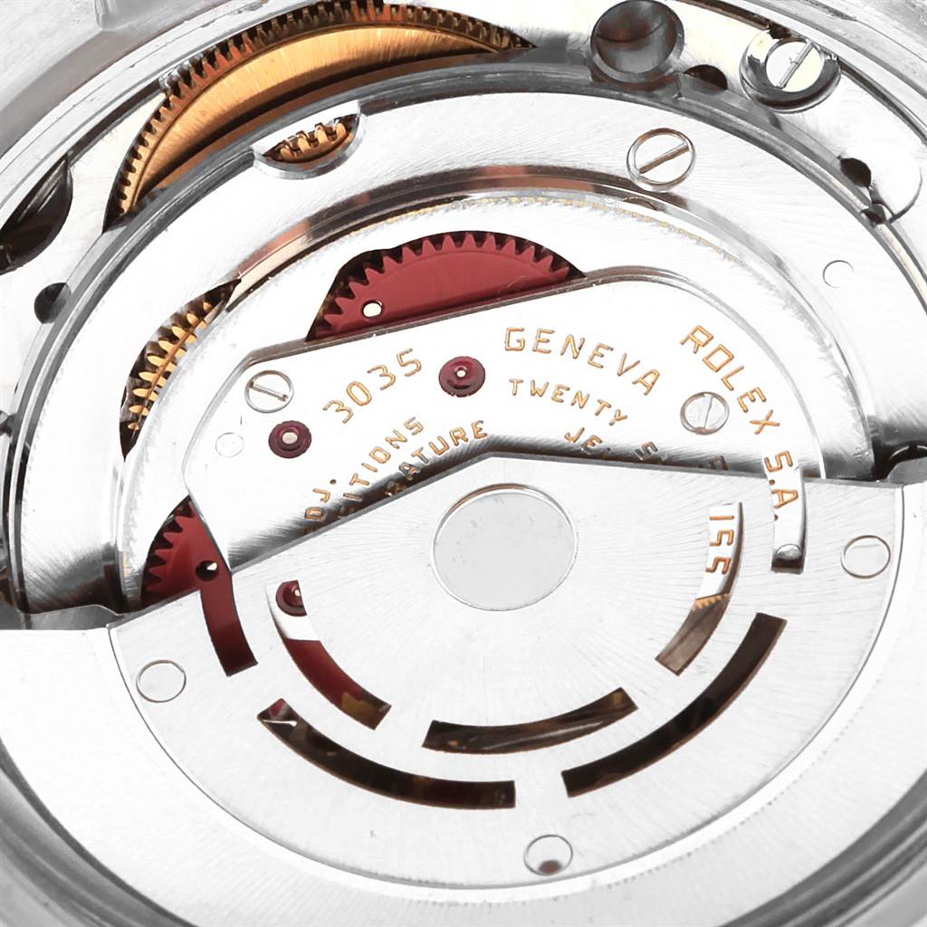 The image shows a close-up of the Rolex Datejust 16013 Men's Stainless Steel Champagne Dial 16013 Men's Stainless Steel Champagne Dial watch's mechanical movement, specifically the rotor and gear mechanism.