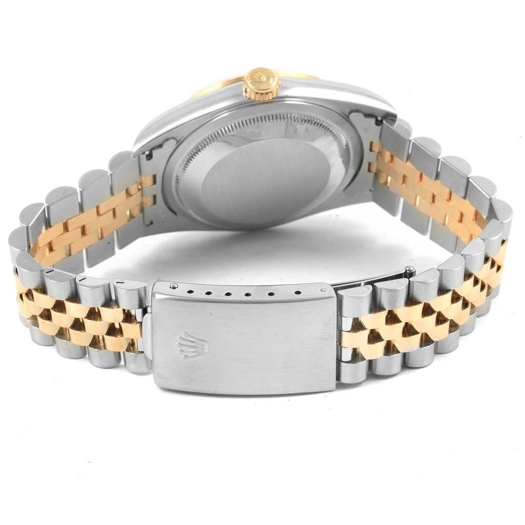 This image shows the back case, crown, and Jubilee bracelet of a Datejust model by Rolex from a rear angle.
