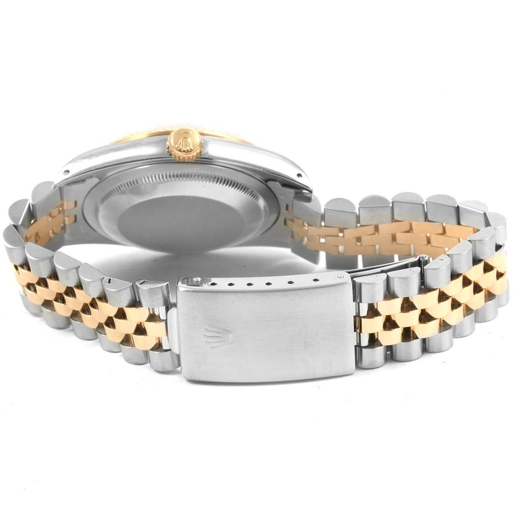 This image shows the back case, crown, and Jubilee bracelet of a Rolex Datejust 16233 Men
s Steel and Gold (two tone) Champagne Dial 16233 Men
s Steel and Gold (two tone) Champagne Dial watch.