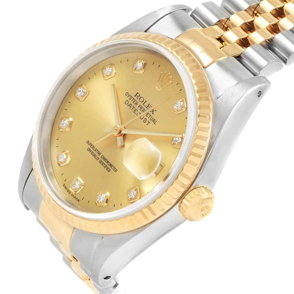 This image shows a Rolex Datejust 16233 Men
s Steel and Gold (two tone) Champagne Dial 16233 Men
s Steel and Gold (two tone) Champagne Dial watch at a slight angle, highlighting its dial, bezel, crown, and part of the bracelet.