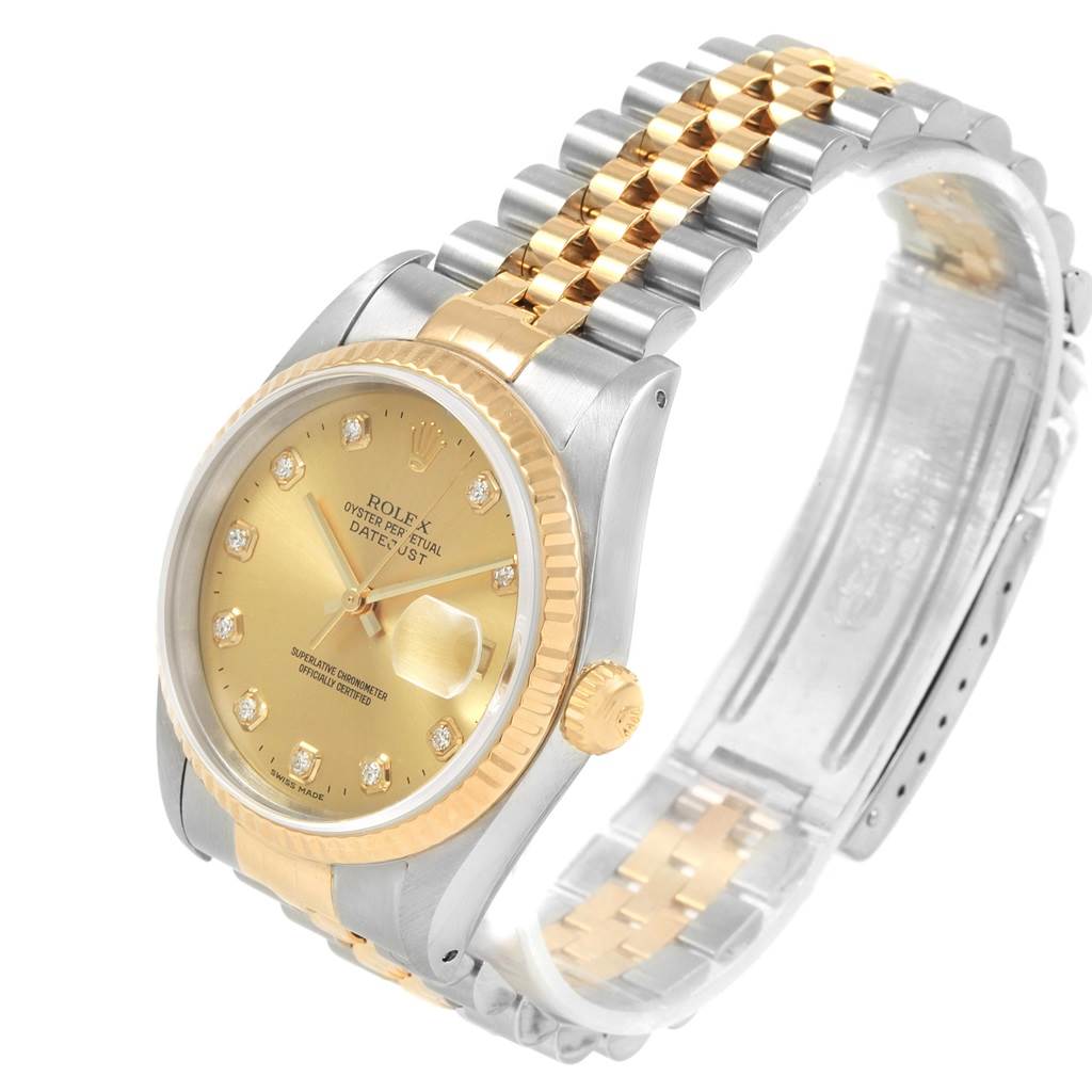 The Rolex Datejust 16233 Men
s Steel and Gold (two tone) Champagne Dial 16233 Men
s Steel and Gold (two tone) Champagne Dial watch is shown at a three-quarter angle, displaying the face, bezel, crown, and two-tone bracelet.