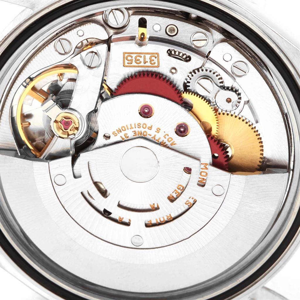 The image shows a close-up of the internal mechanism and gears of a Rolex Datejust 16233 Men
s Steel and Gold (two tone) Champagne Dial 16233 Men
s Steel and Gold (two tone) Champagne Dial watch.
