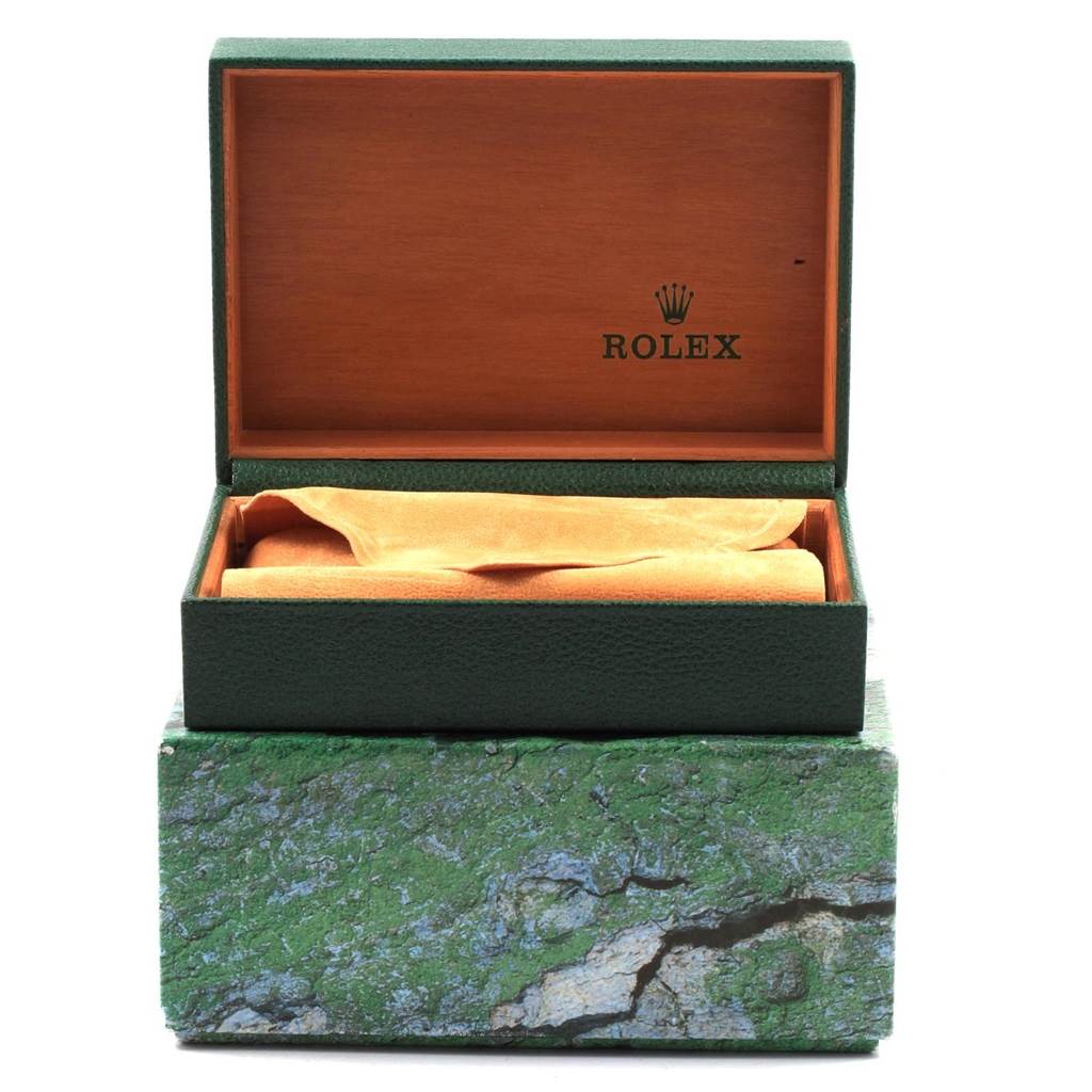 The image shows an open green and wood-patterned Rolex Datejust 16233 Men's Steel and Gold (two tone) Black Dial 16233 Men's Steel and Gold (two tone) Black Dial watch box with a beige cushion inside, viewed from the front.