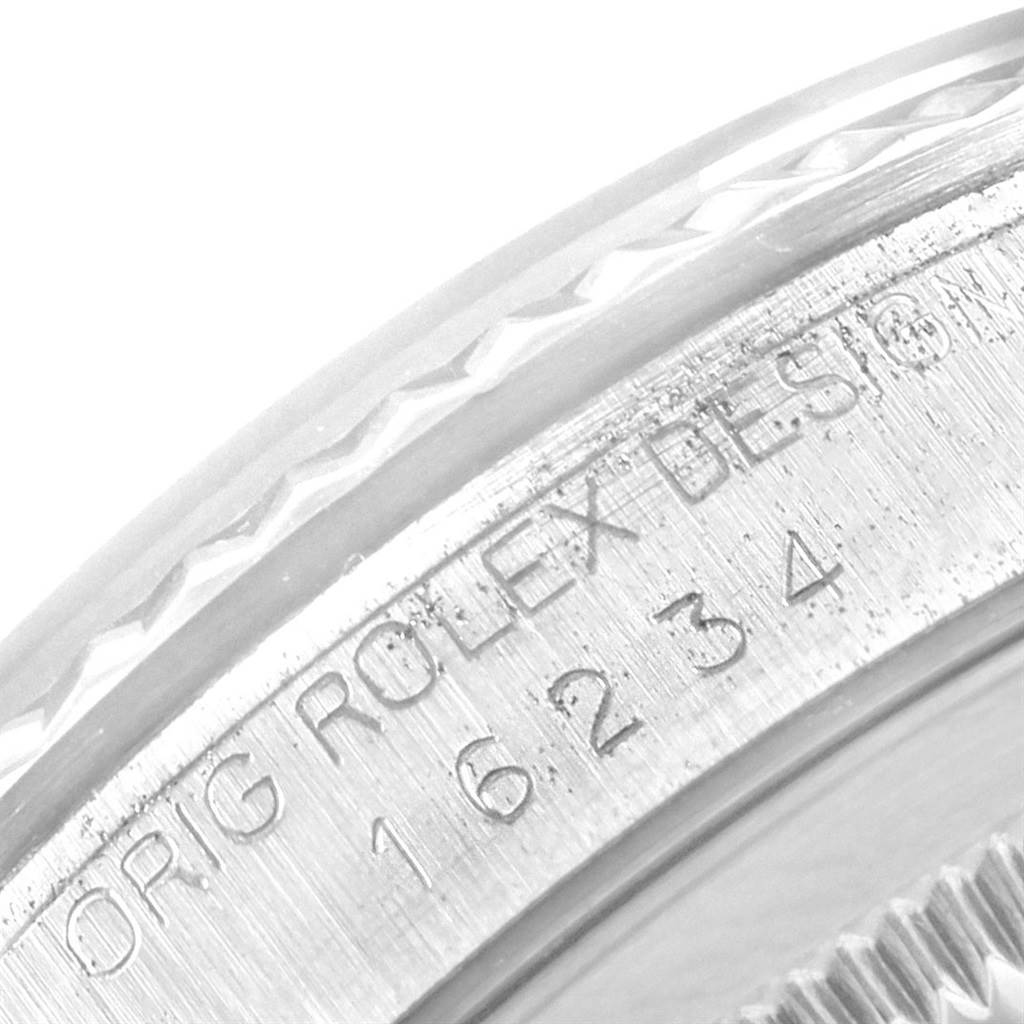 The image shows a close-up of the engraved serial number and branding on the side of the bezel of a Rolex Datejust 16234 Men's Stainless Steel Silver Dial 16234 Men's Stainless Steel Silver Dial watch.