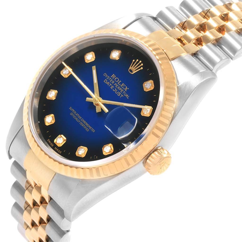 This image shows a close-up angle of the Rolex Datejust 16233 Men
s Steel and Gold (two tone) Blue Dial 16233 Men
s Steel and Gold (two tone) Blue Dial watch, highlighting the dial, bezel, crown, and bracelet.
