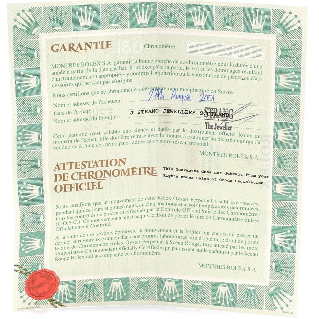 This image shows the warranty and certification document for a Rolex Datejust 16233 Men
s Steel and Gold (two tone) Blue Dial 16233 Men
s Steel and Gold (two tone) Blue Dial watch.