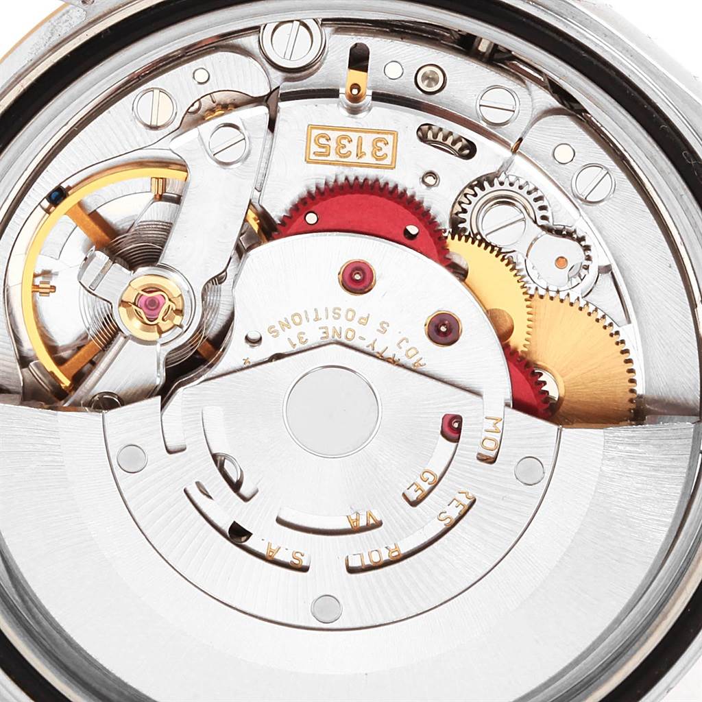 This image shows a close-up of the movement and internal components of a Rolex Datejust 16233 Men
s Steel and Gold (two tone) Blue Dial 16233 Men
s Steel and Gold (two tone) Blue Dial watch.