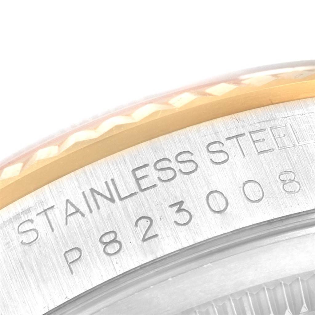 This image shows a close-up angle of the serial number and "STAINLESS STEEL" engraving on the side of a Rolex Datejust 16233 Men
s Steel and Gold (two tone) Blue Dial 16233 Men
s Steel and Gold (two tone) Blue Dial watch.