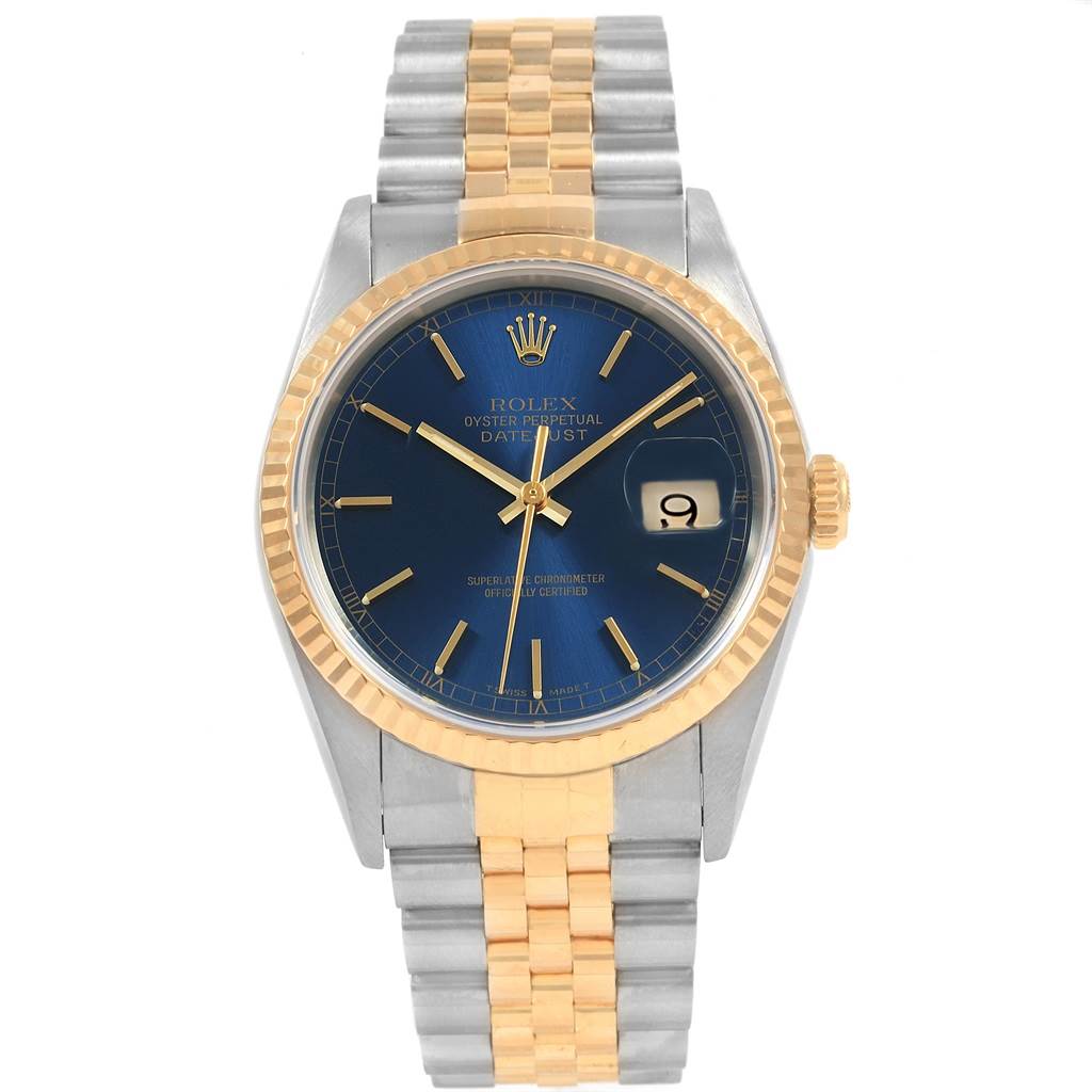 This image shows a Rolex Datejust 16233 Men's Steel and Gold (two tone) Blue Dial 16233 Men's Steel and Gold (two tone) Blue Dial watch from a front angle, highlighting its blue dial, gold bezel, and two-tone bracelet.