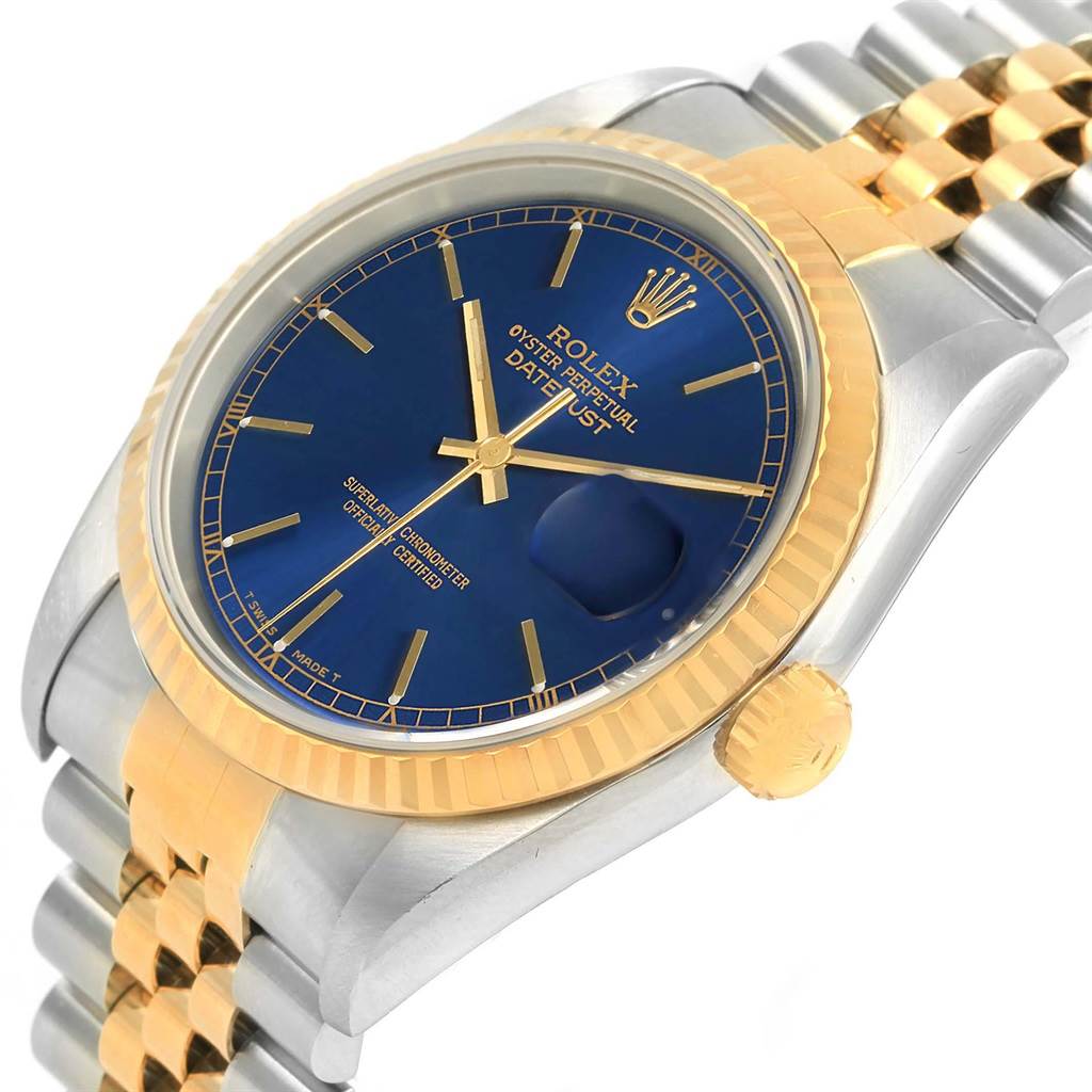 This image shows a Rolex Datejust 16233 Men's Steel and Gold (two tone) Blue Dial 16233 Men's Steel and Gold (two tone) Blue Dial watch from a diagonal angle, highlighting its blue dial, gold fluted bezel, and bracelet links.