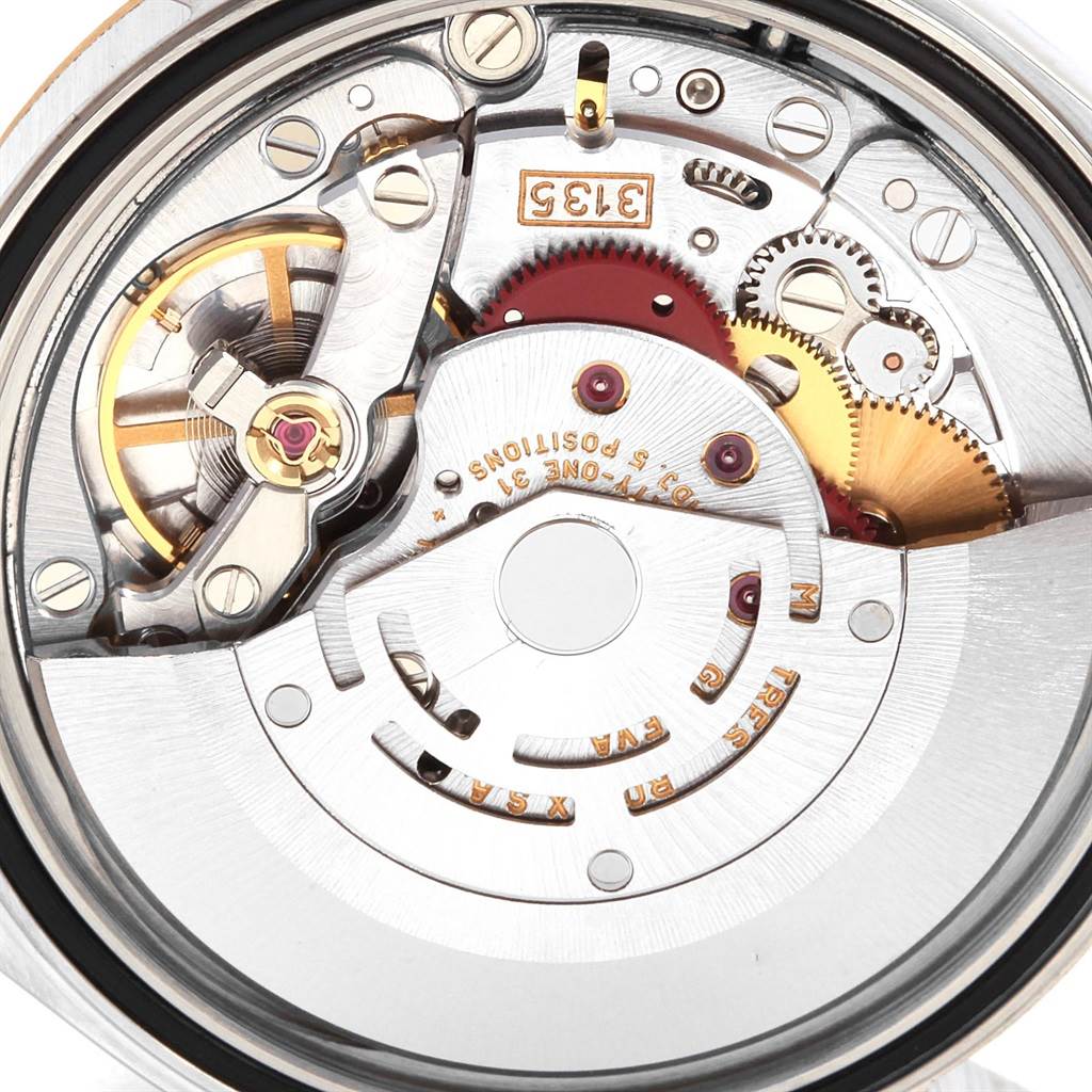 This image shows a close-up of the internal mechanical movement of the Rolex Datejust 16233 Men's Steel and Gold (two tone) Blue Dial 16233 Men's Steel and Gold (two tone) Blue Dial watch.