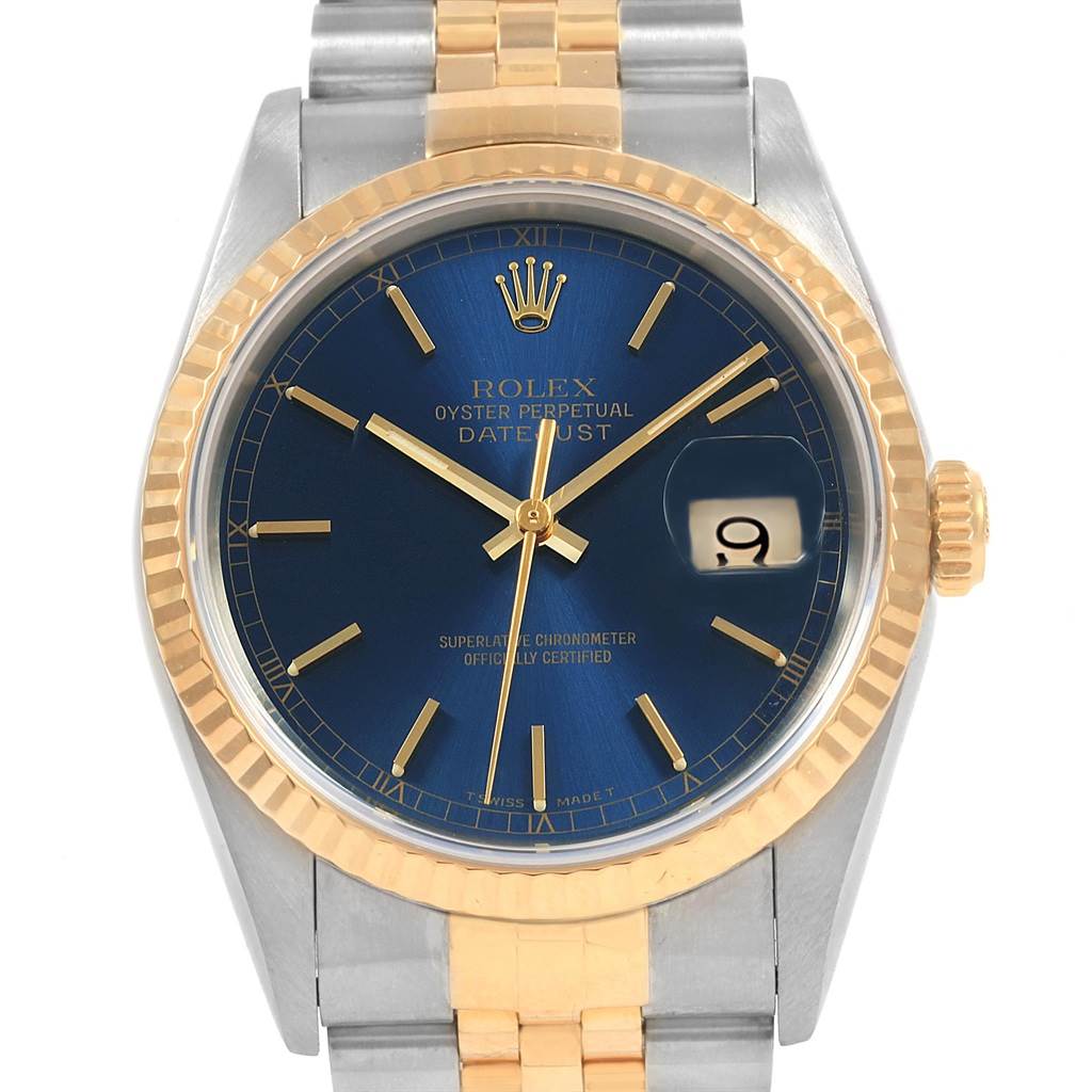 This image shows a frontal view of a Rolex Datejust 16233 Men's Steel and Gold (two tone) Blue Dial 16233 Men's Steel and Gold (two tone) Blue Dial watch featuring a blue dial, gold fluted bezel, and gold and silver jubilee bracelet.