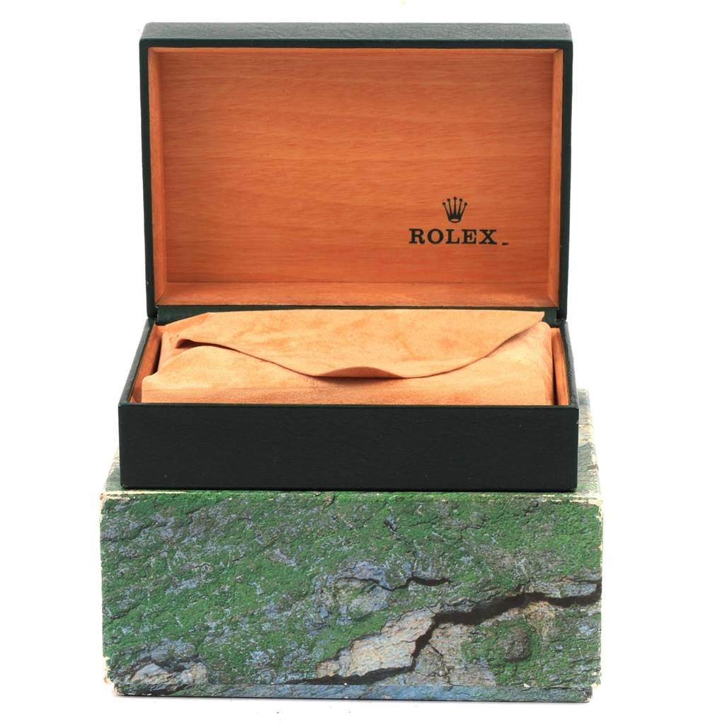 The image shows the open box and cushion of a Rolex Datejust 16233 Men's Steel and Gold (two tone) Blue Dial 16233 Men's Steel and Gold (two tone) Blue Dial watch, highlighting the branding inside the box.