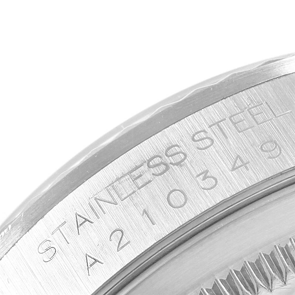 This image shows a close-up view of the stainless steel casing of a Rolex Datejust 16234 Men's Stainless Steel Silver Dial 16234 Men's Stainless Steel Silver Dial watch.