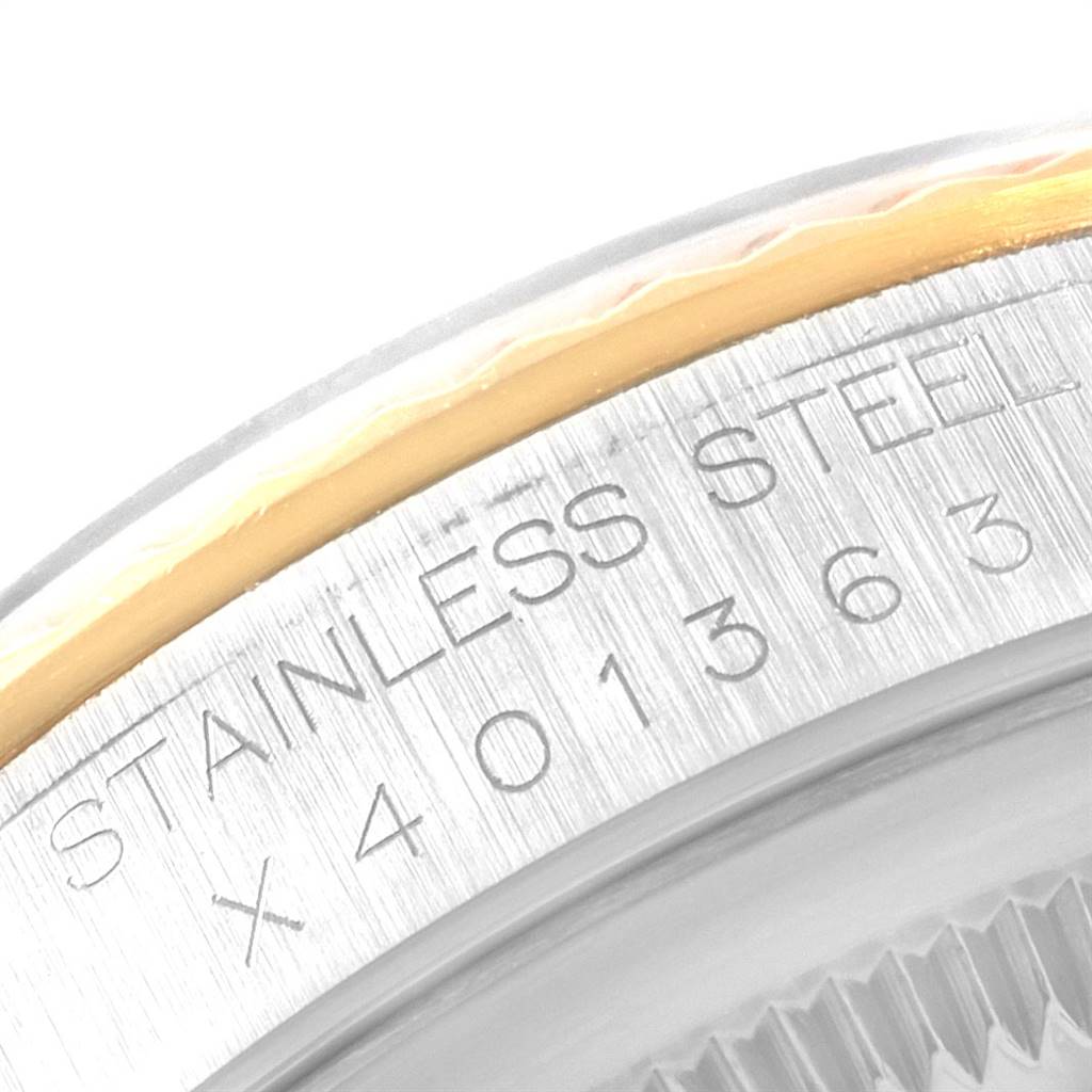 This image shows a close-up of the stainless steel and gold bezel with the model number of a Rolex Datejust 16233 Men's Steel and Gold (two tone) Black Dial 16233 Men's Steel and Gold (two tone) Black Dial watch.