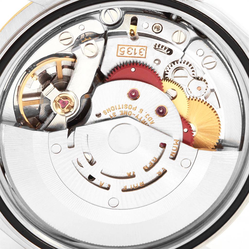 The image shows a close-up view of the internal mechanical movement of a Rolex Datejust 16233 Men's Steel and Gold (two tone) Black Dial 16233 Men's Steel and Gold (two tone) Black Dial watch.