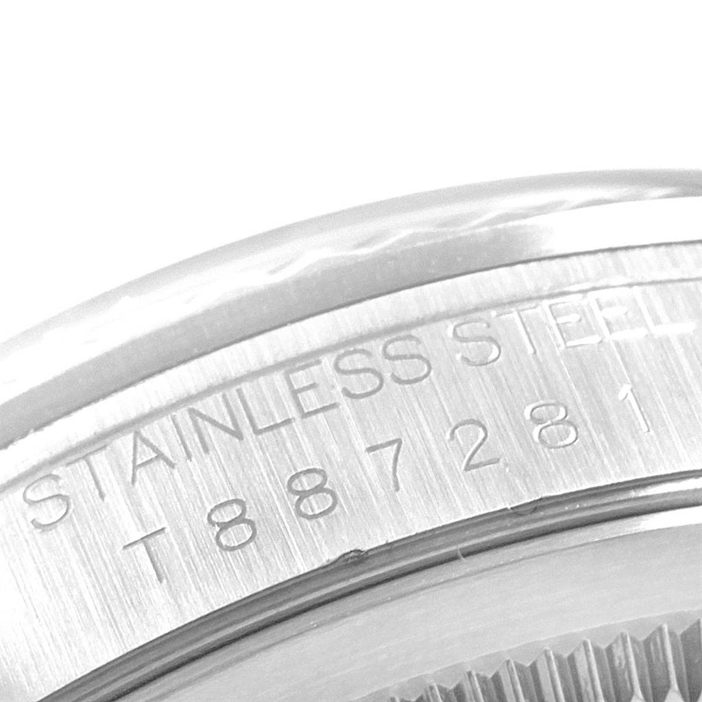 This image shows a close-up of the stainless steel back casing of a Rolex Datejust 16234 Men's Stainless Steel Silver Dial 16234 Men's Stainless Steel Silver Dial watch.