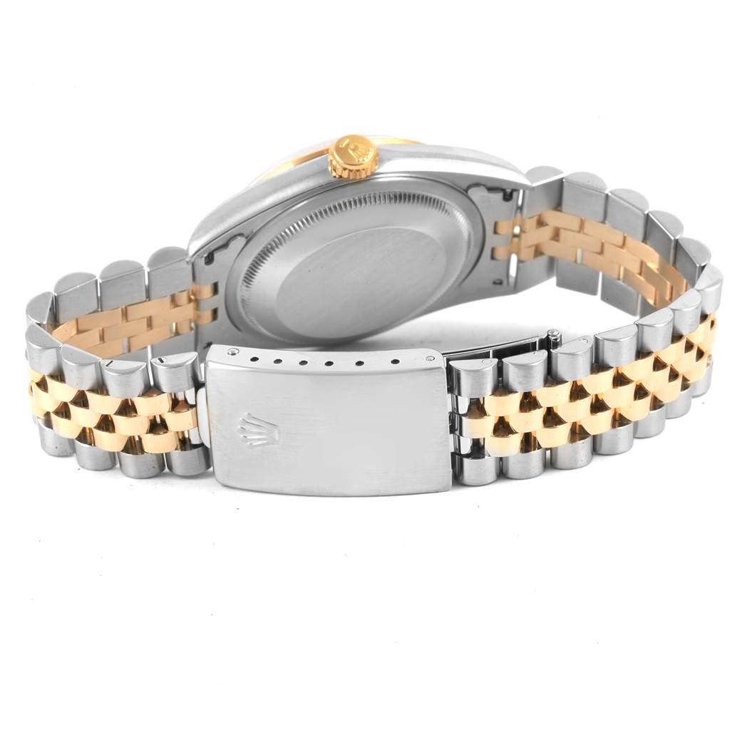 This image shows the clasp, bracelet, and back case of a Rolex Datejust 16233 Men's Steel and Gold (two tone) Champagne Dial 16233 Men's Steel and Gold (two tone) Champagne Dial watch at an angle from the rear.