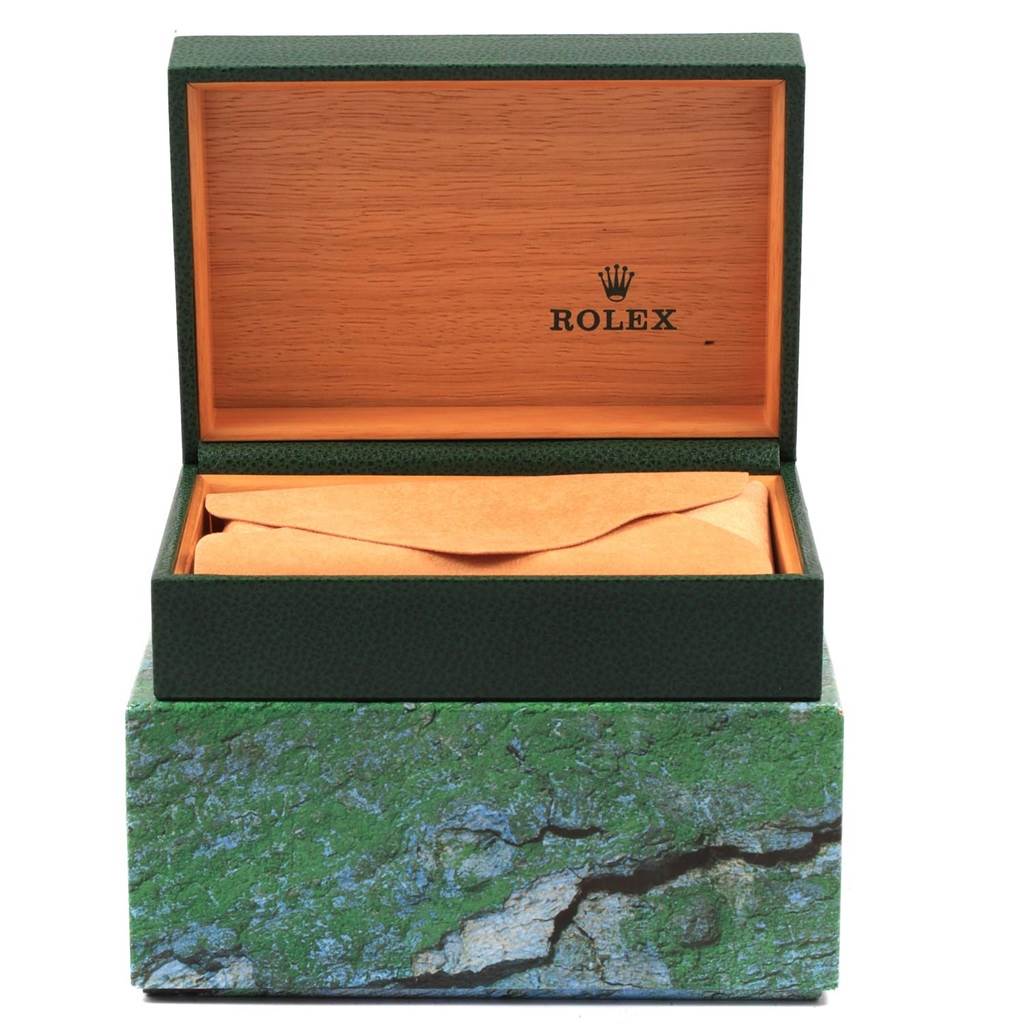 The image shows an open Rolex Datejust 16233 Men's Steel and Gold (two tone) Champagne Dial 16233 Men's Steel and Gold (two tone) Champagne Dial watch box, revealing a wrapped accessory inside.