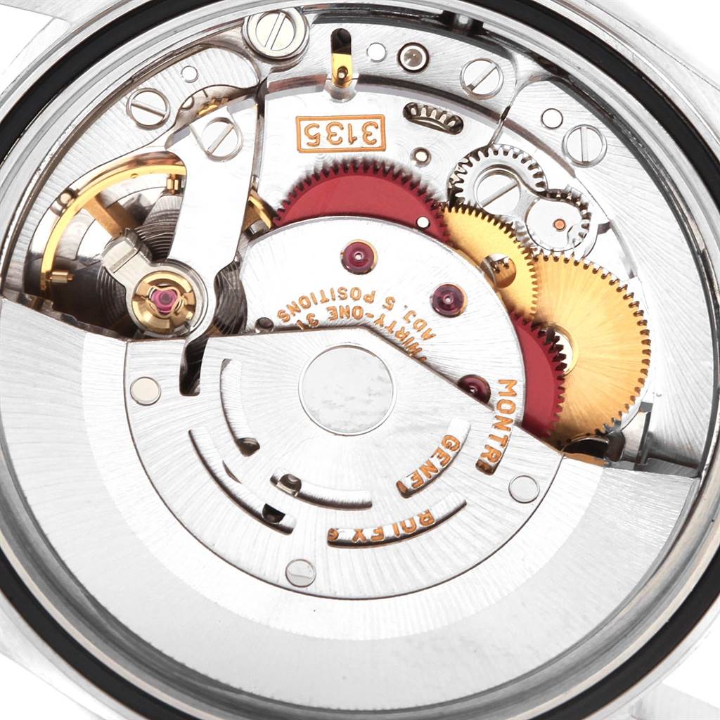 This image shows the internal mechanical movement of a Rolex Datejust 16233 Men's Steel and Gold (two tone) Champagne Dial 16233 Men's Steel and Gold (two tone) Champagne Dial watch, focusing on the gears and rotor.