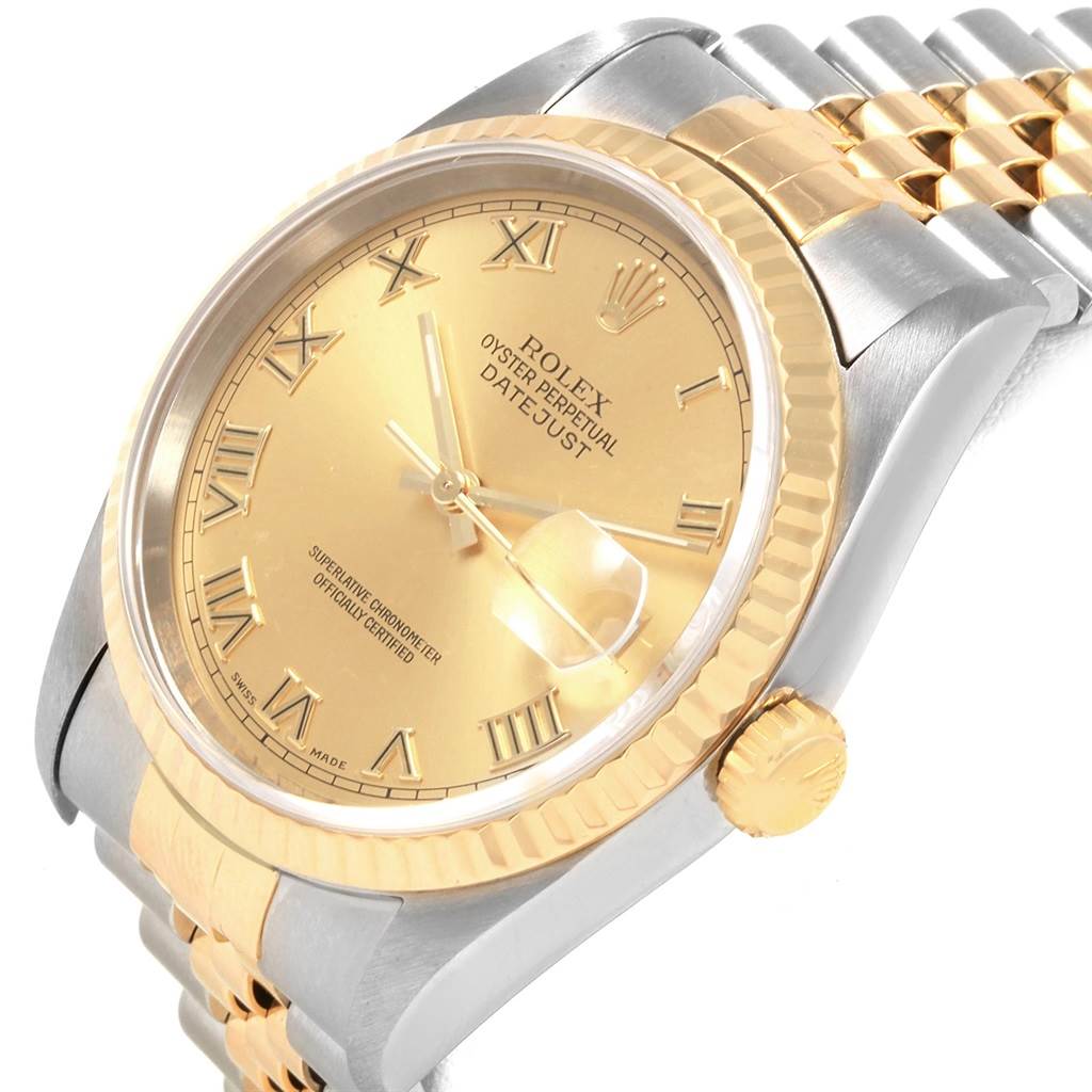 This image shows a close-up, angled view of the Rolex Datejust 16233 Men's Steel and Gold (two tone) Champagne Dial 16233 Men's Steel and Gold (two tone) Champagne Dial watch with a gold dial, Roman numerals, and a two-tone bracelet.